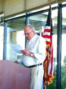 man reading a speech